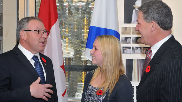 Premier Darrell Dexter chats with Veronica Nicksy, a fourth-year engineering student from Dalhousie University, and NSBI president and CEO Stephen Lund.