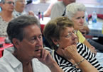 Seniors listens to Health and Wellness Minister David Wilson talk about the province's investment in home care.