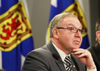 Premier Darrell Dexter responds to a question following the announcement  of the commission.