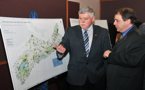 Natural Resources Minister Charlie Parker and Ray Plourde from the Ecology Action Centre look over a map of protected areas and parkland.