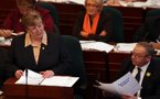 Premier Darrell Dexter watches Finance Minister Maureen MacDonald deliver her budget address.