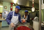 Premier Darrell Dexter and Lucille Saunders make strawberry shortcakes for Meals on Wheels.