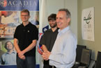 Colibri Software president John Read smiles while standing with programmers Charlie Greene and Alex Sandford.