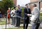 Premier Darrell Dexter shakes hands with Housing Nova Scotia CEO Rob Wood.