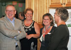 From left, Premier Darrell Dexter chats with Clasina MacKinnon, Laurena Turple and Audrey Engbersen, staff at The Birches.
