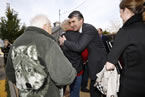 Premier Stephen McNeil hugs a well-wisher after the swearing-in ceremony.