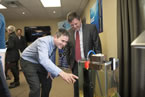 Stephen Jones, CEO of 4Deep Inwater Imaging, demonstrates how some of the technology works to Economic and Rural Development and Tourism Minister Michel Samson.