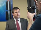 Economic and Rural Development and Tourism Minister Michel Samson looks at an 4Deep Inwater Imaging underwater microscope.