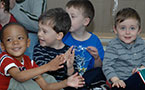 Children smile and clap as Community Services Minister, Denise Peterson-Rafuse announces a $6 million investment in child care in Nova Scotia.