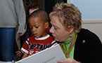 Community Services Minister, Denise Peterson-Rafuse with 3-year-old DeCosta Thomas, one of the children who will benefit from the $1.5 million in expansion funding going to Spryfield's Edward Jost Children's Centre.