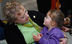 Community Services Minister, Denise Peterson-Rafuse enjoys a moment with 3-year-old MaKayla Hall at the Edward Jost Children's Centre, the site of Tuesday's announcement.