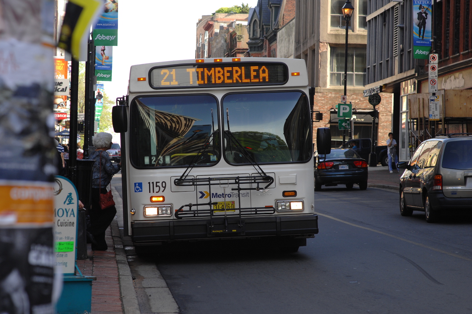 A women getting on Halifax transit bus