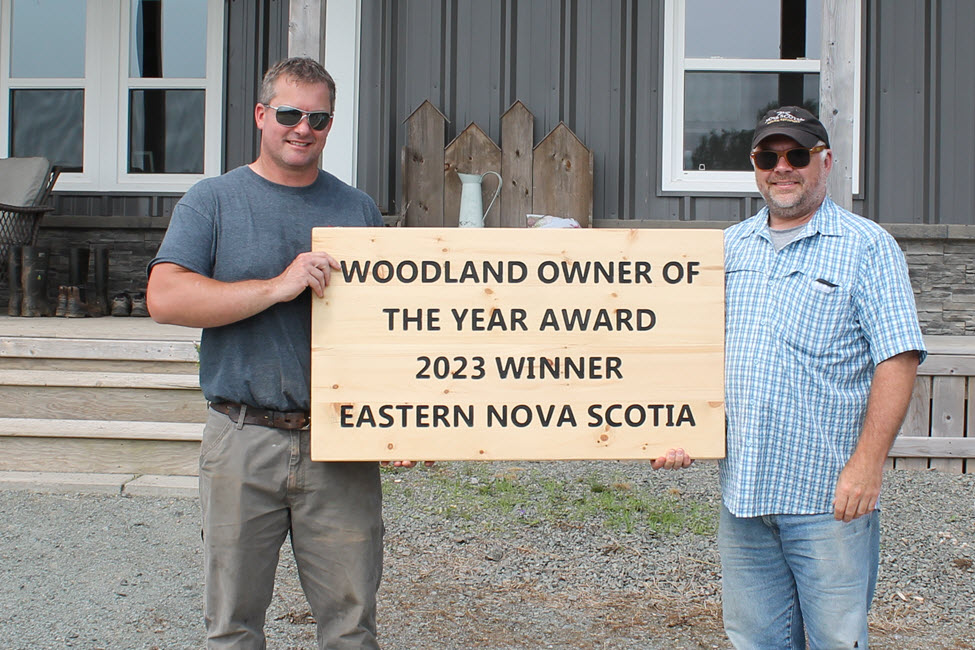 Stephen Van de Weil receives the award for the eastern region from Jason Chard