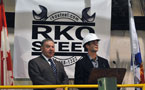 Premier Darrell Dexter (left) and RKO controller Tom Skinner talk at the podium during a news conference at the Dartmouth facility.