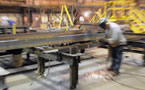 An RKO staff member works on a steel beam at the Dartmouth plant.