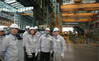 Premier Dexter, with Mr. Du-Seon Park, touring the steel cutting facility at the DSME shipyard.