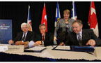 Premier Dexter(right) and Premier Williams (left) sign historic hydro power deal.