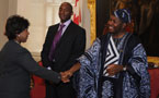 Lt.-Gov. Mayann Francis greets UNESCO program specialist Edmond Moukala 