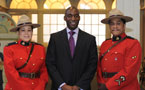Director of the African Diaspora Heritage Trail Foundation Oluremi Bademosi poses with the RCMP.