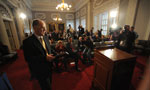 Finance Minister Graham Steele walks to the podium to make a statement about the budget.