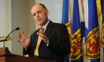 Finance Minister Graham Steele answers a question during a media briefing about the budget.