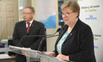 Health and Wellness Minister Maureen MacDonald talks about the new Collaborate Emergency Centres as Premier Darrell Dexter looks on.