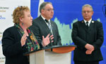 Community Services Minister Denise Peterson-Rafuse talks about the province's largest investment in more than a decade to help low-income families as Premier Darrell Dexter and Major Larry Martin, divisional commander, Maritime division, The Salvation Army look on.