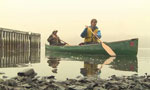 John Brazner and Oliver Maass canoe to work.