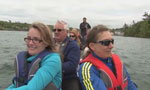 A crew of people at the announcement go on a dragon boat ride at Maskwa Aquatic Club