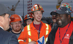 Irving Shipyard workers joke around after learning the company won the federal government's National Shipbuilding Procurement Strategy announcement, which awarded the Halifax shipyard a $25-billion contract.