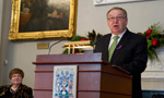 Premier Darrell Dexter wears a purple ribbon while speaking at the ceremony to recognize the  National Day of Remembrance and Action on Violence Against Women as Minister responsible for the Advisory Council for the Status of Women Marilyn More listens.
