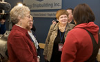Nan Armour (far left), chair of the Canadian Coalition of Women in Engineering, Science, Trades and Technology, speaks with  Labour and Advanced Education Minister Marilyn More.