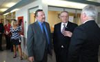 Premier Darrell Dexter (centre) and  Cumberland DHA CEO Bruce Quigley listen to Cumberland Health Authority Board chair Bruce Saunders during a chat at the opening of the All Saints Collaborative Emergency Centre in Springhill.