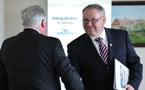 Premier Darrell Dexter shakes Cumberland Health Authority Board chair Bruce Saunders's hand.