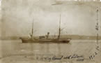 Mackay-Bennett proceeding up Halifax Harbour.  Visible on the deck are coffins containing victims of Titanic’s sinking.