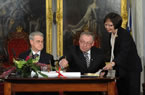 Lt.-Gov. Grant. Premier Darrell Dexter and Justice Linda Oland sign the Oaths of Office and Oaths of Allegiance.