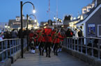 RCMP officers march in the procession on Saturday night.