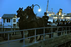 A horse-drawn hearse leads The Gathering and Procession on Saturday night.