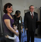 Ilira Mertezi and daughter Era stand beside Donna Sutton and Premier Darrell Dexter.