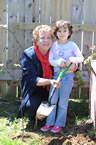 Community Services Minister Denise Peterson-Rafuse stands with Era Mertezi.