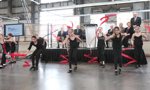 A rhythmic gymnastics groups performs at the announcement.