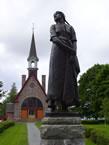 The landmark church in Grand Pré with the Evangeline statue to the right.