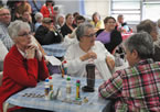 Seniors listens to Health and Wellness Minister David Wilson talk about the province's investment in home care.