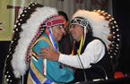 Grand Chief Ben Sylliboy (left) receives a new ceremonial headdress from Chief Rod Googoo.