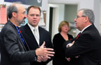 From left: Leo Gaessler, Ultra Electronics Maritime Systems, and Colin Stephenson, executive director of DEFSEC Atlantic, an annual defence and security exhibition and conference, chat with Premier Darrell Dexter before the announcement.
