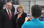 Premier Darrell Dexter and Karen Isenor, GeoSpectrum Technologies Inc., stand together for a photo.