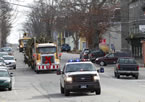An RCMP escort leads the tree for Boston through Shelburne.