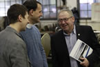 Premier Darrell Dexter shares a laugh with two of the authors of the report from Duke University.