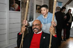 One of the Nova Scotians appearing in the province’s new tourism campaign helps Economic and Rural Development and Tourism Minister Percy Paris on a swing at The Urban Barn.