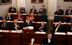 Premier Darrell Dexter leads applause as Finance Minister Maureen MacDonald reads her budget address.
